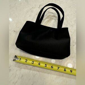 Never carried Nicole Miller black satin double handle special occasion bag